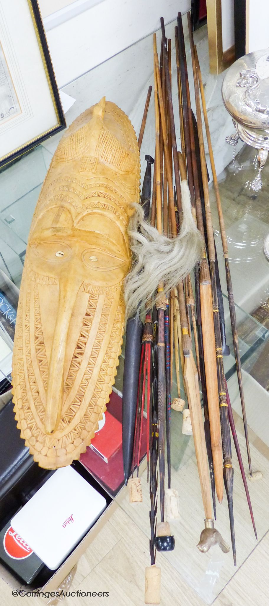A collection of Tribal style spears etc and a mask